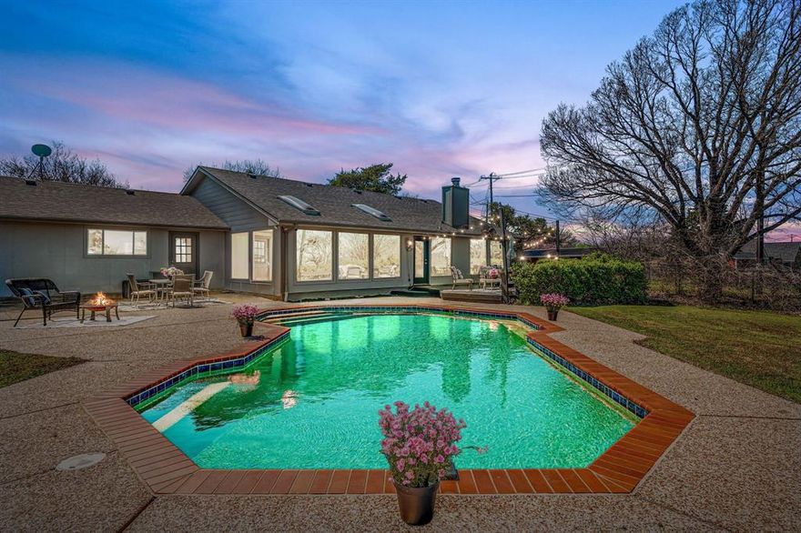 Experience the best of country-style living on 1.67 acres in Anna, TX, offering space, versatility, and beautiful views while still being conveniently close to major roads, shopping, and dining. With its inviting drive-up appeal and peaceful setting, this property truly feels like a private retreat.

Equestrian enthusiasts will appreciate the barn with four stalls and a round pen, while the property also provides plenty of parking and workspace with a three-car garage plus a three-car carport. Just beyond the carport are two additional finished rooms totaling approximately 200 sq ft of air-conditioned space, perfect for a home office, hobby area, workout room, or extra storage.

Relax on the welcoming covered front porch or head to the backyard where outdoor living shines with a deck, patio, and a beautiful gunite in-ground pool, ideal for entertaining or cooling off on warm Texas days.

Inside, the living room impresses with a vaulted ceiling, crown moulding, and picture frame moulding, along with an amazing view of the surrounding property. A woodburning brick fireplace with raised hearth adds warmth and charm. The kitchen offers a smoothtop cooktop and abundant cabinetry for all your storage needs.

A second living area features a wall of windows, perfectly framing the scenic outdoor views and filling the home with natural light. The primary suite includes a large skylight, a stylish barn door leading into the bath, dual sinks, a separate frameless shower, and a spacious walk-in closet.

Features new HVAC with smart thermostat (2022), new roof (2024), pool resurfacing (2024), and new pool pump (2025). With acreage, equestrian amenities, flexible living spaces, and wonderful outdoor features, this Anna property offers the perfect balance of privacy, comfort, and convenience.