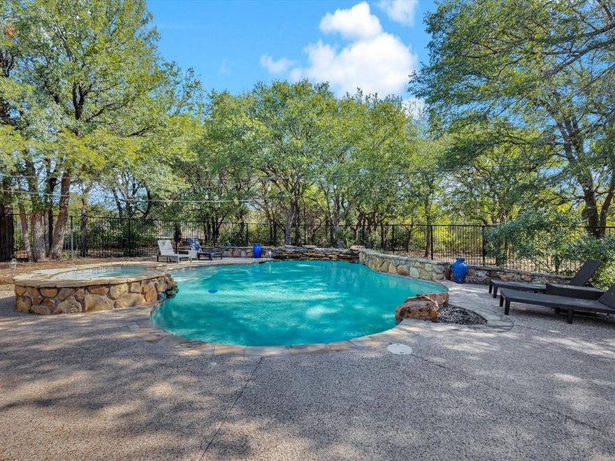 This beautifully maintained home is situated on a private 1-acre lot at the end of a quiet cul-de-sac. This property features 4 bedrooms, 3.5 bathrooms, 2 dining areas, and 3 fireplaces throughout. This is the kitchen dreams are made of with built-in refrigerator, gas cooktop, double ovens, and butcher block island - photos don't do it justice! The downstairs study can be used as an office or fill all the built-ins with your favorite books and you can have your very own library sitting room with a fireplace. Are you sold yet?  Private downstairs guest suite is ideal for visitors or multigenerational living. Enjoy these cooler evenings on the large back patio with views of your in-ground pool and spa and mature trees.  3-car garage offers plenty of storage. This property is a rare combination of space, luxury, and serenity with the conveniences of being close to the city.