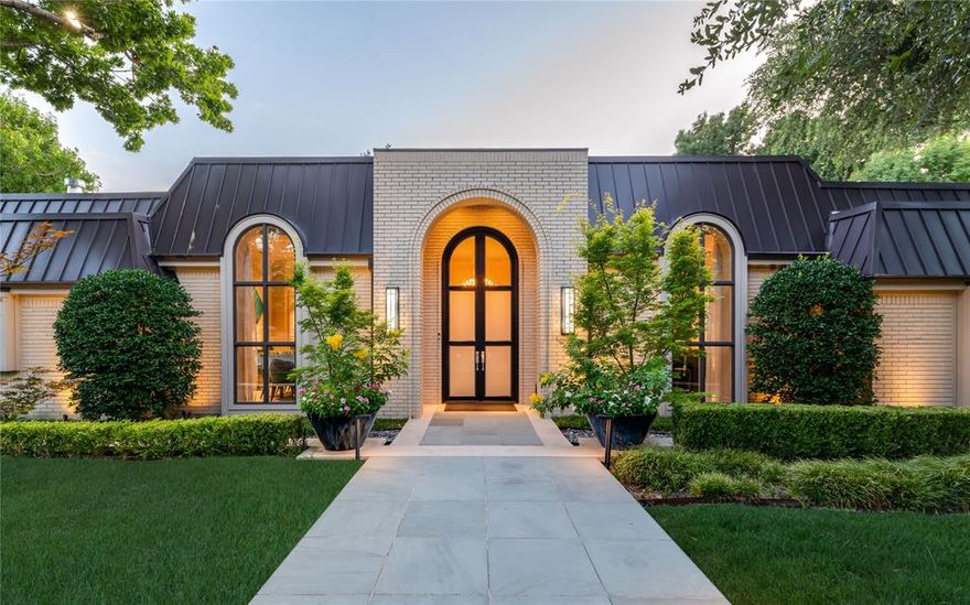 A Rare Creekside Masterpiece in the Heart of Preston Hollow:  Tucked at the end of a quiet cul-de-sac in one of Dallas’ most coveted enclaves lies a home that defies convention and defines luxury. 10989 Crooked Creek Dr is not just an address, it's a work of art. This single-story estate sits on nearly one acre backing to a serene private creek, an exceedingly rare setting that blends architectural elegance with nature’s tranquility, right in the heart of the city. Collaboratively reimagined by a dream team of famed architect, designer, and builder, every detail of this home speaks to intention, craftsmanship, and exceptional design quality. Beyond the manicured circular drive, step through dramatic iron doors into a world of marble floors, soaring arched windows, gallery lighting, and vibrant custom artwork. The interiors are polished yet playful, channeling a high-fashion aesthetic with bold textures, rich finishes, and sculptural details throughout. The heart of the home is a show-stopping chef’s kitchen featuring dual islands, book matched exotic stone, Wolf appliances, and custom cabinetry that blends modern utility with timeless style. It opens effortlessly to multiple living spaces made for entertaining, all with views that spill out to the lushly landscaped courtyard, pool, and creekside backdrop. The primary wing is a resort-style sanctuary complete with fireplace, spa bath, dual rainfall showers, jetted soaking tub, and a magazine-worthy closet with private laundry and custom built-ins. Outdoors, the grounds rival any five-star retreat, expansive patios, mature trees, a sparkling pool, sculptural landscaping, and the calming presence of the creek just beyond. It’s serenity and sophistication, minutes from the city’s best private schools, fine dining, and luxury shopping. This is more than a home, it’s a statement. And it’s waiting for the buyer who recognizes the rare and remarkable when they see it.