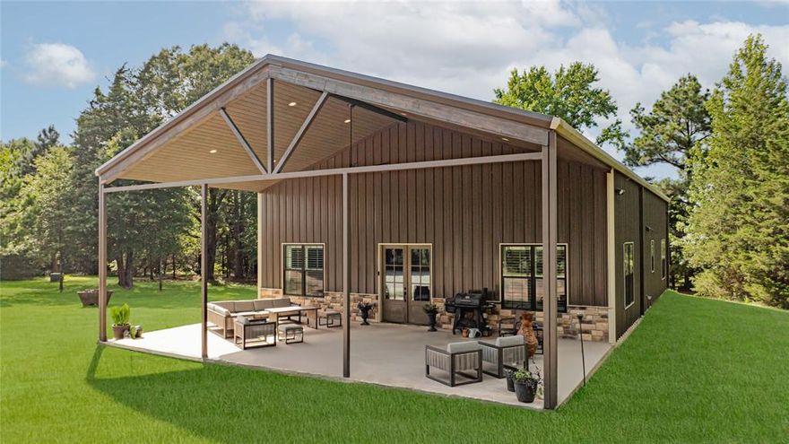 2,2,LOFT WITH APARTMENT-CUSTOM BARNDOMINIUM ON 12 ACRES From the moment you arrive, you're welcomed by
clean lines, rustic-modern finishes, and a layout that blends functionality with relaxed style. Inside, the open-concept living
area boasts soaring ceilings, abundant natural light, and sleek, high-end finishes. The modern kitchen flows seamlessly into
the dining and living spaces—perfect for everything from casual dinners with loved ones to weekend entertaining. This isn't
your typical barndo! There are custom upgrades throughout including Brazilian granite countertops, hidden nooks behind
bookcases, oversized bedrooms, and a spacious laundry room designed for everyday ease. Step outside to a standout
feature—an expansive covered patio overlooking open pastures and mature trees. Whether you’re grilling, relaxing with
friends, or enjoying quiet views of the countryside, this outdoor space makes every moment feel like a retreat. The land
offers more than just scenery: there’s room to roam, raise animals, or farm. A peaceful half acre pond, grazing pasture, and a
blend of cleared and wooded land makes it ideal for those seeking space and tranquility without sacrificing modern comfort.
Additional improvements include a 1,000 sq ft shop AND a 300 sq ft apartment or guest suite—perfect for guests, a college student, or as rental income to potentially offset costs if needed. A pole barn doubles as a carport with extra room for equipment and parking. Though secluded, the property is ideally located near the Mt. Pleasant Country Club and Towne Lake, within minutes of town, I-30, and several other lakes including Tankersley, Lake Bob Sandlin, and Lake Cypress Springs. This one is priced to SELL! It is your chance to own a thoughtfully designed, high-end rural retreat in the heart of the East Texas Piney Woods. The possibilities are endless!