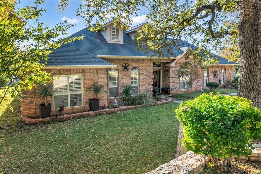 Are you looking for a home near Lake Granbury?  This beautifully renovated 3 bedroom, 2 bath home in desirable Decordova Bend Country Club will not disappoint!  Upon entering the home you will notice the details and love that have been put into it by its current owners.  Updates include flooring, bathrooms, paint, light fixtures, kitchen appliances and much more!  Wonderful open floor plan.  Walk out back and enjoy your morning coffee under the covered patio and overlook the amazing yard this home offers.  Sprinkler system offers minimal yard maintenance.  There is a shop out back that is fully insulated and has electric, AC and heat!  It is currently being used as a art studio but the possibilities for it are endless.  Home also offers a golf cart garage off of the 2 car garage that can be used for storage or to store your toys from the outdoors.  Decordova Bend is a gated community which features 2 manned gated entrances, marina and lake access for Lake Granbury, golf course, tennis, pickleball, swimming pool, sand volleyball court, and a full service restaurant and bar.  Welcome home!