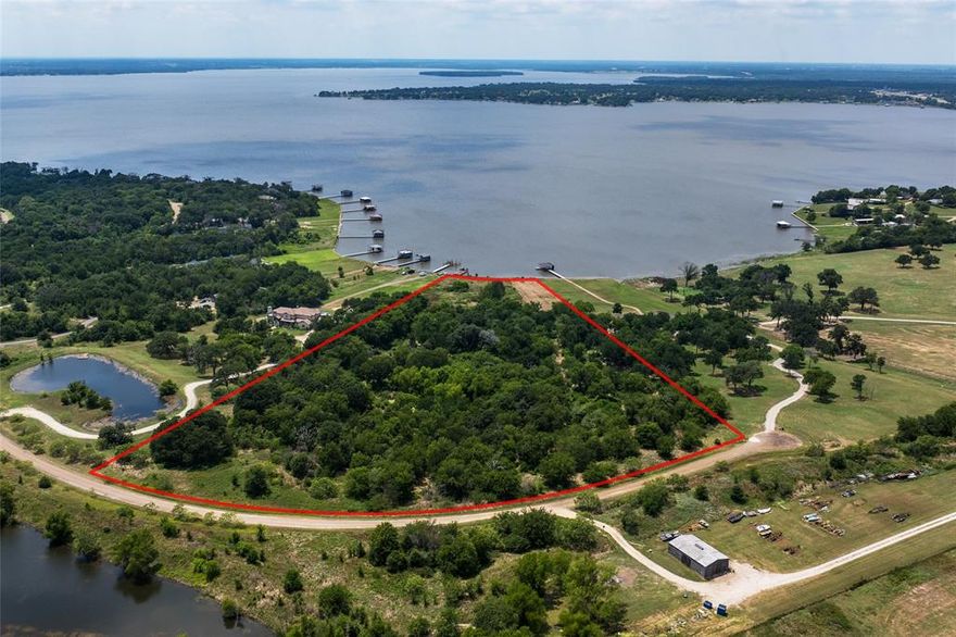 Rare opportunity to build your family's ideal retreat on this incredible double ranch lot in the exclusive gated community of 505 Ranch at Cedar Creek.  Enjoy your custom lakefront compound on over 12 acres located only one hour from DFW.  These exclusive ranch size lots offer the benefits of private acreage combined with waterfront access, along with the ability for outbuildings including barns with horse stalls.  This beautifully treed property offers tranquility, privacy, sweeping views, direct lake access and all of the benefits of 505 Ranch.  Shared amenities include a clubhouse, pool, guest cottages, fishing ponds, wooded hiking paths, ATV trails, a renowned equestrian center, riding arena, polo field, skeet range & more.  The community has controlled gated access,  24 hour staff and at an additional charge concierge services are available to prep your future home each weekend.