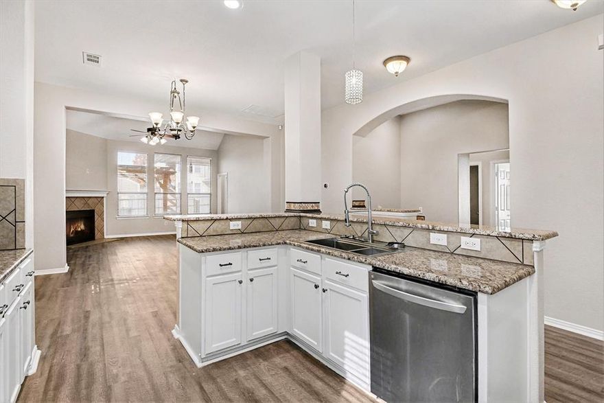 MARINE CREEK RANCH 5 BEDROOM- MOVE-IN READY HOME! 6109 Shad Dr is located in the Marine Creek Ranch community of Fort Worth, this home places you within Eagle MT–Saginaw ISD, walking distance to Ed Wilkie Middle School, and near additional schools. The community features a pool, boat ramp, clubhouse, and scenic jogging and walking paths, along with quick access to the Trail Connection that leads directly to Marine Creek Reservoir. This spacious property includes 5 bedrooms and 3.5 bathrooms, along with a fenced backyard and a covered patio with a pergola. Inside, the open layout connects the kitchen and living room, highlighted by white cabinetry and a welcoming fireplace. A flexible room near the front entry can serve as a dedicated home office or an extra bedroom. The primary suite is located on the main level and features high ceilings, dual sinks, a soaking tub, a glass-framed shower, and a walk-in closet. Upstairs, a loft, additional bedroom, and full bathroom create an ideal setup for guests or multi-generational living. This home is move-in ready and thoughtfully designed for comfort and convenience. Don’t wait, schedule a tour today and submit your best offer. Discounted rate options and no lender fee future refinancing may be available for qualified buyers of this home.