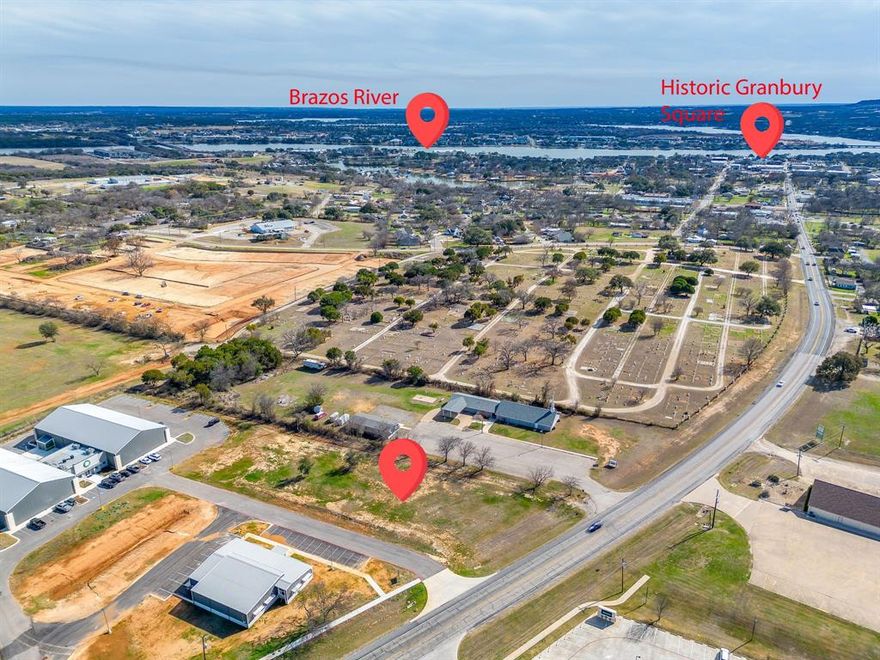 Zoned Heavy Commercial - This lot fronts on the Weatherford Hwy (Houston Street) with existing entrance on Tucker Way.  Common area maintenance agreement for Lots 1-4. City water, co-op electric, septic available, sewer close by. Excellent commercial location just north of Granbury Square.