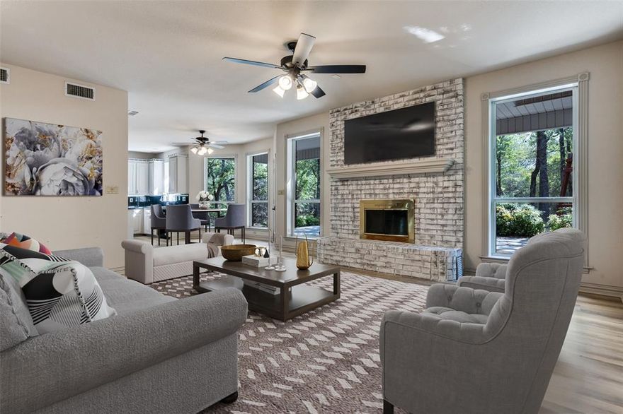 Interior just updated! Nestled on just over 6 serene, wooded acres filled with mature oak trees, this stunning 3,005 sq. ft. custom-built traditional home is a showcase of timeless charm and classic Southern elegance. Featuring iconic white columns and expansive covered porches, this elegant 4-bedroom, 2.5-bath residence offers beauty, character, and warmth in every detail. A picture of stately sophistication, the home's grand exterior & thoughtfully designed architecture evoke a sense of classic estate living. Its commanding presence is matched by a warm, welcoming interior that blends traditional craftsmanship with everyday comfort. Step inside to discover all-new flooring throughout & rich stained wood accents that bring a sense of heritage and refinement. The heart of the home includes an efficient wood burning fireplace that heats the space beautifully. The spacious primary suite boasts a recently updated en-suite bathroom with luxurious shower, a walk-in closet & a hidden closet cleverly tucked away for discreet storage-a unique touch that adds both charm and practicality. The guest bedrooms are generously sized with walk in closets. A versatile game room provides the perfect setting for movie nights, pool tables, or a kids’ space, easy to relax or entertain. The kitchen features custom wood cabinets, granite countertops & walk in pantry. Covered porches invite morning coffee or quiet evenings under the trees, while the sprawling acreage offers incredible potential for gardening, adding a workshop, or guesthouse. Wildlife lovers will appreciate the regular visits from deer making this property feel like your own private retreat. Enjoy seamless indoor-outdoor living with generous porch space, ideal for relaxing or entertaining amidst the privacy of a gated & fully fenced estate. Located in a prestigious neighborhood, this home offers both security and privacy in a peaceful, nature-filled setting. Don’t miss this rare opportunity to own a truly special property!