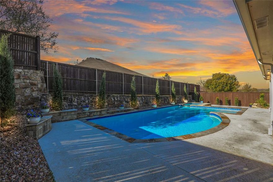Discover this exceptional large Single Story Home featuring Private Backyard Heated Pool & Spa perfectly positioned on a hilltop lot with an unparalleled outdoor experience!  This secluded oasis delivers breathtaking vistas with stunning sunsets and treetop views. Enjoy tranquil evenings on the large patio or entertain friends and family around the sparkling heated pool and spa. Open floorplan designed for both everyday comfort and effortless entertaining. Spacious living areas flow seamlessly together, including a main living room anchored by Stone Fireplace with Gas Logs and large windows overlooking the pool and a second living area ideal for sitting area, music or entertaining.  The gourmet kitchen is the true heart of the home, featuring a massive granite island, abundant knotty alder cabinetry, stainless appliances, gas cooktop, granite countertops, travertine backsplash, walk-in pantry. A dedicated study plus an additional home-office nook provide the flexibility today’s lifestyle demands. The private primary suite is a sanctuary with tranquil views of the pool, an extended granite vanity with dual sinks, separate shower, and a massive walk-in closet 11 ft. x 12 ft. Two secondary bedrooms share a well-appointed full bathroom.  Smart home features.  OVERSIZED Garage with 30 ft. depth on one side with extra storage room and Polyaspartic flooring.  Lush Landscaping designed for beauty and low maintenance with side yard grass area for pets. Utility Room with Storage Cabinets and Sink.  Nest Thermostat and Rachio Smart Irrigation system. This McKinney gem offers a unique blend of elegance and comfort, that seamlessly combines luxury with the natural beauty of its surroundings. Zoned for McKinney ISD with prime location close to 380, 75, Hub 121 entertainment districts, Restaurants, Whole Foods, HEB, Sprouts and Trader Joe's.