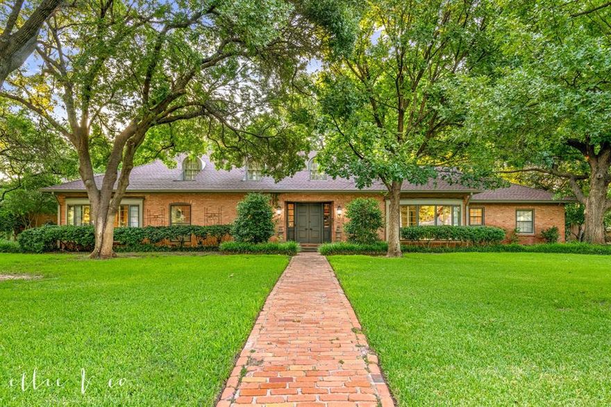 Elegant and timeless, this 4 bedroom 4 bath home is nestled on over 1.2 beautifully landscaped acres with private creek access-offering rare seclusion right in town.  A perfect blend of historic charm and modern luxury, the home features original moldings, woodwork, pocket doors, and three working fireplaces.  The renovated kitchen is a chef's dream with top-tier Viking appliances, Sub-Zero refrigerator, wine fridge, walk-in pantry, and a built-in desk area.  It opens to a cozy hearth room with fireplace, creating an inviting space for everyday living.  The formal living room with fireplace connects to a spacious dining room, ideal for entertaining.  A light filled den overlooks the covered patio, fountain, and backyard through French doors with screen-perfect for enjoying good weather year-round.  The original study or library, complete with fireplace, offers flexible use as a fourth bedroom with an adjacent full bath. The primary suite offers potential for dual bathrooms-both beautifully updated with marble finishes and heated floors. Two additional bedrooms are generously sized with large windows that bring in natural light.  All bathrooms have been completely renovated with upscale finishes and heated floors. Additionally, the home offers over 950 of walk-up attic space that could easily be finished to create living space, more bedrooms, a gameroom, or media room.  A standout feature is the newly renovated 1-bedroom,1-bath guest house, complete with living area, kitchenette, and private patio-perfect for guests, extended family, or private office space.  The expansive yared features mature landscaping, creek acces, and privace that makes it feel like there are no nearby neighbors.  This is a truly special in-town property offering privacy, character, and modern convenience-ready for its next chapter.