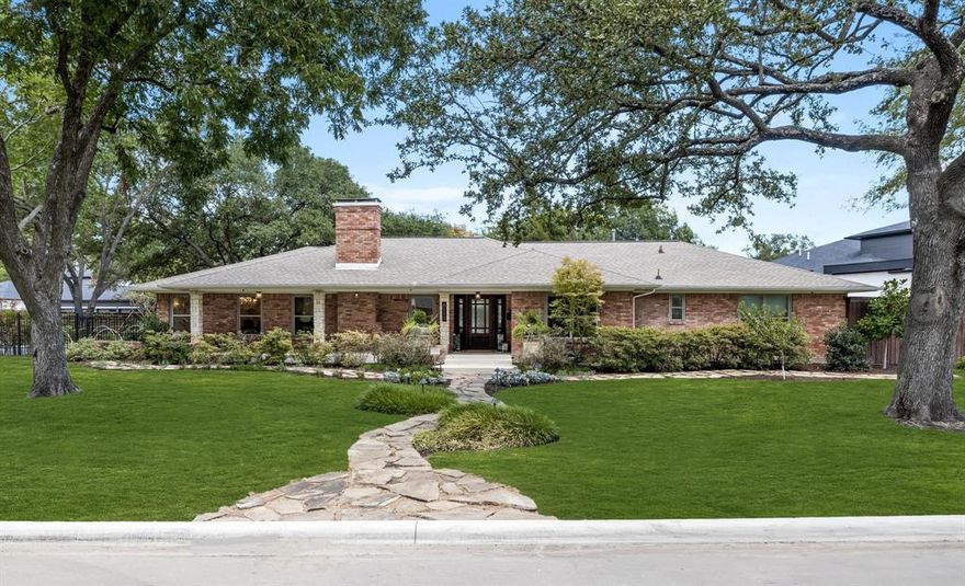 Nestled on a sprawling corner lot in the coveted Preston Hollow neighborhood, this stunning residence seamlessly combines classic charm with modern sophistication. Surrounded by mature trees and lush landscaping, the home offers an inviting retreat within one of the most sought-after areas. Step inside to discover a thoughtfully updated interior where comfort meets elegance. The open floor plan is designed for both everyday living and grand entertaining. The chef’s kitchen boasts an expansive island, custom cabinetry with hidden pantry, top of the line appliances, and built-in Miele coffee machine and Elkay filtered water dispenser. The primary suite serves as a private sanctuary, complete with two closets and a secluded courtyard. The spa-inspired bath features a walk-in shower, soaking tub, and elegant designer fixtures. Outdoors, the tranquil and private backyard is a beautifully designed oasis, ideal for embracing the classic indoor-outdoor lifestyle.