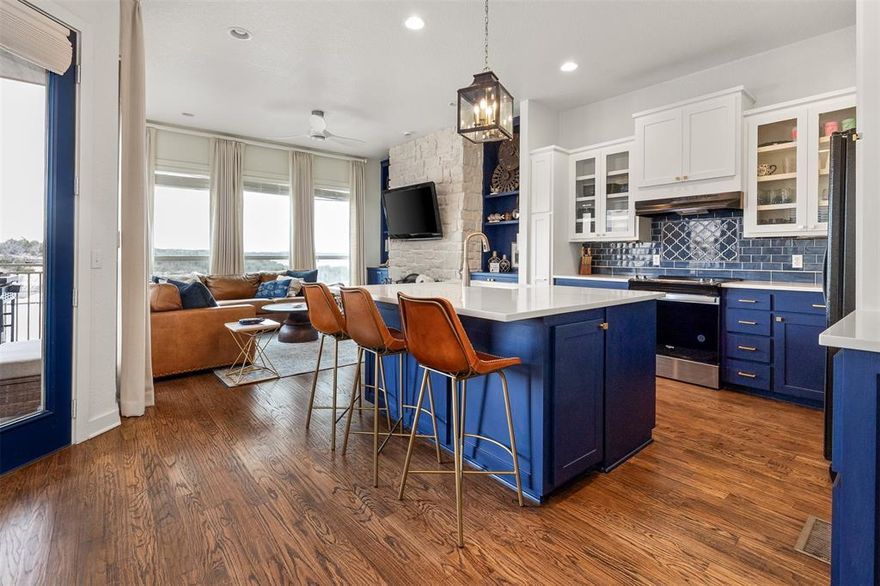 With a cool, coastal vibe and high end finishes this beautifully remodeled 4 bedroom 4 bath town house makes lake life the easy life and a perfect retreat for family and friends. This small community of townhomes enjoy a sparkling pool steps from your front door and the lake is a short walk from your retreat. Upon entering the 1st floor is a flex room with closet and full bath. The kitchen has been updated with quartz counters, new appliances and lighting. The open living dining and kitchen make entertaining a breeze. The generous balcony is perfect for indoor outdoor living. The views abound beyond the open living kitchen dining area. This floor also has a guestroom and full bath. The beautiful staircase leads to an additional guestroom, bunk room and primary suite with a gorgeous walk-in shower, separate vanities, and a private deck to enjoy morning coffee and the most amazing sunrises. This home currently sleeps 20 with the multi bunks that occupy three of the bedrooms. However, these can be removed for single beds. This home will not disappoint! Sportsmans World also has a private air strip, community pavilion, tennis and pickle ball courts all for your enjoyment! Furnishings negotiable.