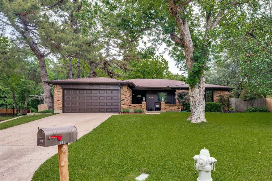 Beautifully maintained home tucked away on a quiet cul-de-sac in a highly desirable location! This inviting home features a spacious living room with soaring vaulted ceilings, exposed wood beams, and a stunning woodburning fireplace with a floor-to-ceiling stone hearth. The open-concept floorplan flows seamlessly into the dining area and kitchen, complete with abundant cabinetry, granite countertops, stainless steel appliances, and plenty of prep and storage space. The private primary suite offers an ensuite bath featuring an oversized walk-in shower, separate vanities, and his-and-hers walk-in closets. Step outside to enjoy the huge covered patio overlooking a private backyard that backs to green space — with no back neighbors! Conveniently located with easy access to I-20 and zoned for highly sought-after Martin High School, this home combines comfort, style, and an unbeatable location. Don't miss seeing this one!