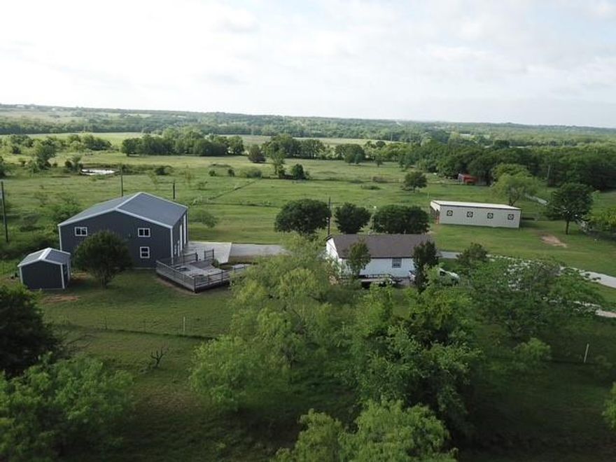 Paradise awaits! Just 45 minutes from the hustle and bustle of DFW, you'll find one of very few, 10-acre tracts, without a single pipeline beneath, nor flood plain atop, an absolute unicorn in north Texas! The current owners have recently updated the cozy 2 bed, 1 bath home at the front of the property, perfect to live on the property while you build your countryside dream home, generate income as a rental, or just enjoy it for yourself as it is. After spending time outdoors, riding horses, riding atvs, or just watching the chickens scratch the ground, relax indoors in the newly constructed, 40x40, spray foam, heated-cooled, epoxy floored shop with loft, and a full bath. Also boasts a large utility room, in case you're tired of relaxing, and it's been fully wired and plumbed for future full kitchen. Outside you'll find 2 large barns with electric and water, one with a storage-tac room and separate stalls.  Also, there is a newly constructed 8x10, insulated well house, great for extra storage, and a new, in-ground storm shelter.  Bring your animals, or just bring yourself, come see what Paradise has to offer.

AG Exemption is current

Farm equipment is negotiable
