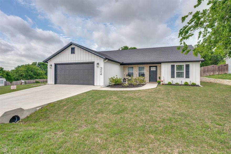 Discover exceptional value & modern style in this beautifully crafted 3-bedroom, 2-bath, 2-car garage home in Fort Worth—located in a transitioning neighborhood where revitalization is driving opportunity. Enjoy the benefits of newer construction at a price point rarely found in fully established communities, making this an ideal blend of affordability & long-term upside. From the moment you arrive, the curb appeal stands out with striking white board-&-batten siding, an inviting Austin stone, covered front porch, & sleek slate gray accents on the roof, shutters, & garage door. Inside, the open-concept design is elevated by cathedral ceilings & durable luxury vinyl plank flooring throughout, with ceramic tile in wet areas for added function. The kitchen is a true centerpiece, featuring custom white cabinetry, quartz countertops, stainless steel appliances, & an undermount sink overlooking the expansive backyard. The split-bedroom layout offers privacy, with a spacious primary suite boasting a large walk-in closet & a beautifully tiled walk-in shower. Secondary bedrooms are generously sized as well. Step outside to a massive backyard—over a quarter acre—perfect for a future pool, outdoor living space, or garden retreat. The extended patio is ready for your dream pergola setup. Located in the highly sought-after Aledo Independent School District, known for top-rated academics & strong community support. Convenient access to major highways including Interstate 20 & Interstate 30 puts you within easy reach of major employers such as Lockheed Martin & Texas Health Resources, along with abundant shopping & dining at Shops at Willow Park & Clearfork. This is the opportunity buyers have been waiting for—schedule your private showing today & see the potential for yourself! NOTE: This home is equipped with a water softening & reverse osmosis system installed at the cost of many thousand dollars! The system provides clean, filtered & odor free water-a must-have for this area