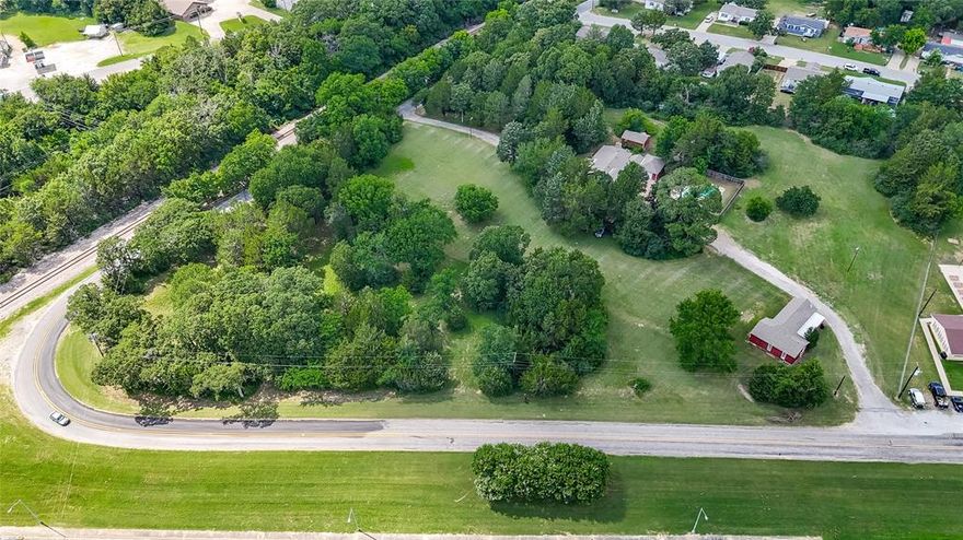 Is there a 3-bed farmhouse on 5+ acres at 3321 Vine Lane that offers space, privacy, and in town convenience? Yes. This charming and unique property delivers acreage living while remaining close to everyday amenities, making it a rare opportunity for buyers seeking land without sacrificing location.

Inside, the warm and welcoming entry opens to a spacious living area anchored by a beautiful fireplace, ideal for gatherings and holiday hosting. The dining room features built in china cabinets and generous space for comfortable meals and entertaining. The kitchen is designed for functionality with abundant counter space, two sinks, and all appliances included.

The home offers three bedrooms, three full bathrooms, and extensive storage throughout. Step outside to a covered patio for relaxing and a workshop with electric, perfect for projects or hobbies.

The in ground pool was installed by Allison Landscaping and Pool Company and includes a diving board, tanning shelf, and water feature, all surrounded by a wooden privacy fence that creates a private summer retreat. Adding even more flexibility is a 1,000+ square foot guest home with a kitchenette and full bathroom, ideal for extended stays or additional living space.

This 3-bed farmhouse on 5+ acres at 3321 Vine Lane offers land, character, multiple living spaces, and in town proximity all in one property. Please see this cross listed property under MLS#20979838 to view the endless development potential this property also has to offer!