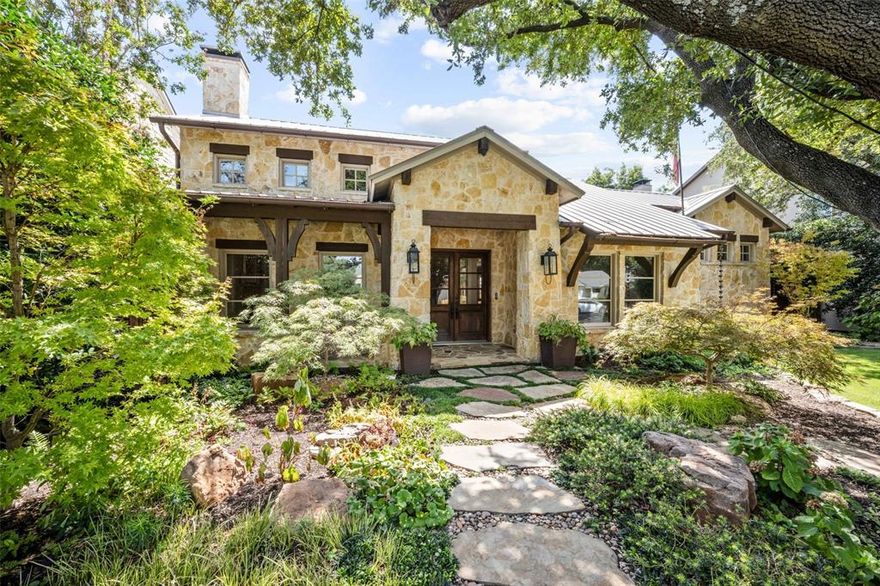 Possessing a spectacularly transitional pallet that hints toward Texas Hill Country style, this one is an absolute delight! Situated on heavily treed, professionally landscape lot, indoor-outdoor living are ONE. Built for the ages, elements like the stone exterior, standing metal roof, cedar beams and walls of windows are hallmarks of true quality. Tall ceilings compliment ideal room proportions and the open floor plan easily flows. An ample and light primary and auxiliary en-suite bedroom are at opposite ends of the first floor. The hub of the dwelling is the central kitchen-den where large gatherings will linger. The perfectly-scaled granite island and surrounding countertops compliment stainless appliances like Viking, Sub-Zero, KitchenAid, and Fisher and Paykel. Upstairs is like a tree house whereby family and guests are treated to a sunny nook, inviting living-game space, two large bedrooms and an irresistible covered porch.