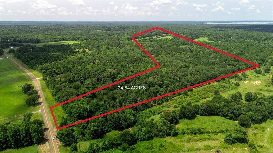 Discover the perfect blend of privacy, natural beauty, and opportunity with this 25+ or -acre tract located in Quitman, Texas, in the heart of Wood County. Just minutes from world-renowned Lake Fork, this wooded property offers both recreational appeal and long-term value. With a timber agriculture exemption already in place, you'll enjoy significant tax savings while having the freedom to build your dream home, weekend retreat, or private getaway. The land features a pond to go fishing,a  beautiful mix of mature hardwoods and pines, gently rolling terrain, and multiple potential building sites, making it ideal for a homesite, hunting property, or investment opportunity. Situated on a quiet county road with no restrictions, the possibilities are endless—bring your house plans, barndominium ideas, or simply enjoy the property for its natural beauty and seclusion. Whether you're looking to live off the land, invest in rural East Texas, or create a peaceful escape near the water, this property offers a rare chance to own unrestricted acreage just minutes from some of the best fishing and boating in the state.