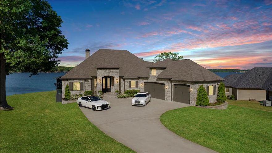 Immerse yourself in lakeside luxury at this waterfront haven on Lake Palestine in the Windrock gated community. With over 200 ft of lakefront access, this opulent residence offers unmatched sophistication. The backyard features a pool, hot tub, pool cottage, and outdoor kitchen for al fresco dining. Adorned with high-end furnishings, the home boasts panoramic lake views and a boathouse with a boat and jet ski lift. Spanning 5100 sq ft, with 4 bedrooms, 4 baths, 2 full size kitchens and 2 living spaces, this property is a rare opportunity for luxury living on Lake Palestine. This complete turnkey property includes a Yamaha 275SD yacht-certified boat, two Yamaha waverunners, and high-end furnishings and decor throughout the home.