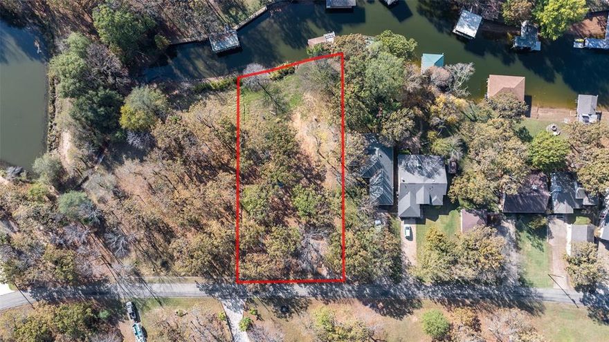 Two great level, buildable waterfront lots in Point La Vista. One lot has a seawall and boathouse with good water depth, close to open water. Nice mature trees on the southeast end of the lake. Lots of room that would make the perfect home base for RV and separate free standing garage. Perfect spot for your retirement dreams. For a walk about YouTube video, Google the TheLakeGuy CCL 5540.