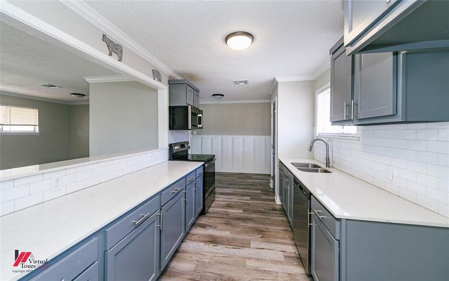 Located at the end of Caroline Drive, this property is the last house on the left of the cul-de-sac. With nearly 1 acre across 2 combined lots, it is one of the largest properties in the subdivision, giving you room to spread out that is hard to find in this area.

Inside, the kitchen features quartz countertops, subway tile backsplash, stainless steel dishwasher, electric range, and a breakfast bar pass through to the living area that keeps everything connected. The living and dining areas flow together, creating an inviting gathering space with easy to clean vinyl flooring throughout and decorative wall detail. A built in buffet in the dining area adds extra cabinet storage and serving space. Sliding glass doors from the living room lead to the covered back porch and spacious backyard, blending indoor and outdoor living.

The remote primary bedroom includes a private ensuite bathroom with tiled shower, decorative floor tile, and vanity mirror. Three additional bedrooms provide flexibility for guests, hobbies, or office space. One secondary bath includes a tiled tub and shower surround.

The expansive backyard provides space for games, recreation, gardening, a future pool, or creating your own outdoor retreat. A detached storage shed adds practical storage for tools and equipment.

Roof replaced in 2023. Some flooring and interior walls could use a little TLC, giving the next owner an opportunity to refresh and personalize.

Convenient to I 20, BAFB, shopping, dining, and everyday essentials. Seller willing to consider allowance with favorable offer.