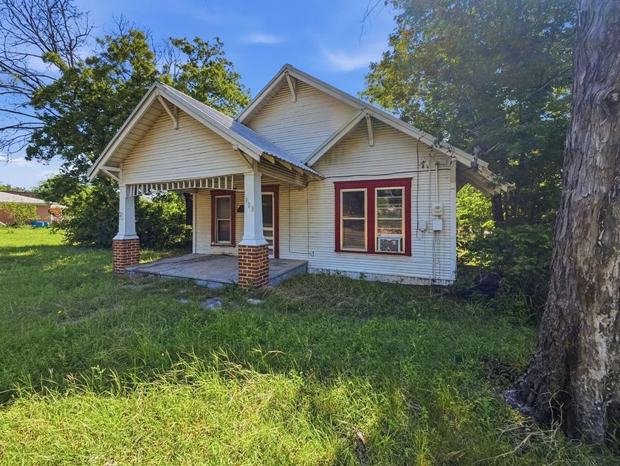 COMMERCIAL POTENTIAL WITH HIGHWAY 281 FRONTAGE! Situated on a high-visibility corner lot at 908 S Rice St, this property offers approximately 125 feet of frontage on State Hwy 281. Currently a 1,032 sq. ft. 3 bedroom, 1-bath frame home, the property is being sold as is and is a prime candidate for a full remodel or a commercial conversion.

Built in 1945 the home features a durable metal roof, hardwood floors un exiting flooring and a pier-and-beam foundation. The oversized corner lot provides ample space for parking or expansion. Whether you’re looking for a residential fixer-upper with a massive yard or a strategic business location in the heart of Hamilton, this property offers endless possibilities. Buyer to verify all zoning and utility requirements for commercial use.