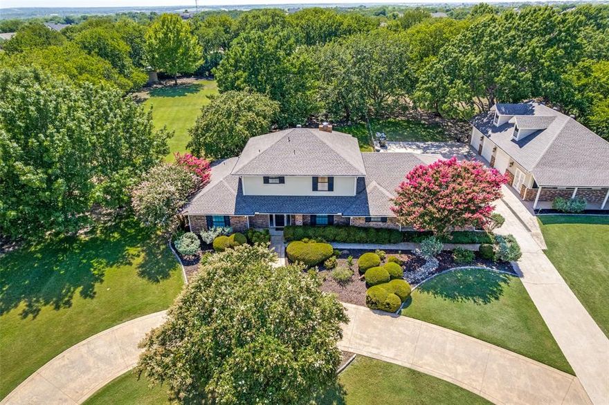 Located in the secluded neighborhood of Benbrook Lakeshore, this home set on 1.44 acres allows for a multitude of lifestyle opportunities. Enjoy quiet mornings and tranquil evenings on the covered patio overlooking this home’s expansive backyard nestled under mature trees. Practice hand crafts or rebuild cars in the expansive three-car garage with workshop. Entertain friends and family with many opportunities inside and outside. The four-bedroom home has been meticulously maintained and loved by the same family for almost three decades. The primary bedroom has an ensuite bath with a door leading to the sunroom allowing for backyard access. The primary bedroom is split from the three upstairs bedrooms but a nearby office could serve as a nursery. Or use the office with built-in cabinetry and shelves as intended as private workspace. The large eat-in kitchen boasts oversized countertops with breakfast bar and a large island.  An abundance of storage is available in the multiple cabinets and walk-in pantry. The family room is off the kitchen allowing the living room to be a formal space or a place to relax at the end of the day. The family room leads to the backyard and detached garage. The oversized garage has 1,680 sq. ft. with a staircase leading to the attic. The outdoor kitchen is on the covered patio and leaves plenty of space for outdoor furniture. This home is located just minutes south of the Benbrook Lake entrance and Whitestone Golf Course off Hwy. 377 and Tiger Trail. It’s a quick commute to Benbrook, Interstate 20, and Fort Worth for shopping, personal services, and entertainment. Benbrook Lakeshore Neighborhood Association is voluntary. It includes the community center, neighborhood events, and additional water storage tank for Fire Department use.