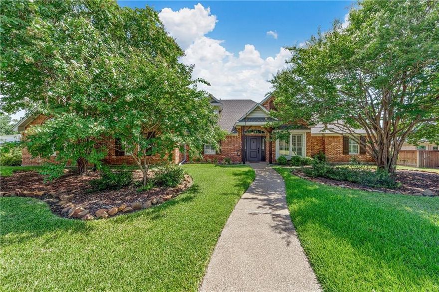 Beautiful custom home with stunning curb appeal, beautiful mature trees that add to the serene ambiance of the neighborhood. As you enter this well maintained home, you will walk into the spacious living room with a beautiful fireplace sounded with built-ins and plenty of natural light.  On each side of the fireplace there are two other guest bedrooms and a full guest bathroom.  The spacious kitchen is surrounded with lots of custom cabinets with plenty of storage, walk-in pantry, double oven, coffee bar, large island, and breakfast area that opens up to the second living area making it very easy to interact with guests while preparing dinner. The isolated primary suite is located on the opposite side of the home, complete with en-suite bathroom featuring separate vanities, a soaking tub, a separate shower, and 2 separate walk-in closets. More added charm to the home is crown molding, plantation shutters and a third living area or flex space with a built-in Murphy bed for extra guests. There is an attached carport with an automatic gate entry and storage room. Enjoy the oversized covered patio to host outdoor dining, sit around the built in firepit while grilling and more. Located on a corner double lot just shy of half an acre providing ample room for outdoor activities or gardening that allows you to create your own personal paradise with privacy, and tranquility.