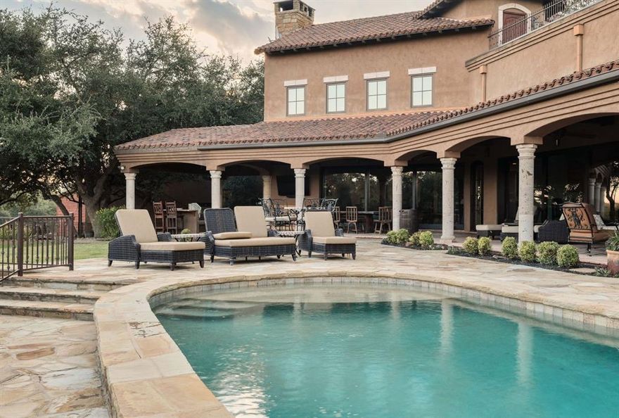 Set on 37 plus scenic acres with a half-mile of Pedernales River and Fall Creek frontage, this stunning Spanish-style estate offers over 11,300 sq. ft. of living space in the heart of Texas Hill Country, just 30 minutes from Austin.

Smaller Acreage Option Available.

The 7,300 sq. ft. main residence features 4 bedrooms, 5 full baths, 3 half baths, and exquisite craftsmanship, including Saltillo tile floors, hand-plastered walls, and custom wood and iron accents. A chef’s kitchen, butler’s kitchen, wine storage, expansive exercise room, and state-of-the-art stereo system add to the luxury. Three fireplaces provide warmth and ambiance, while multiple patios invite outdoor living.

A 3,000 plus sq. ft. guest house offers 3 bedrooms, 3.5 baths, a fireplace, and a full kitchen. Additional amenities include a 1,000 plus sq. ft. hobby shop, over 3,300 sq. ft. of garage space, and a heated pool with a jacuzzi. Owners have access to a private boat ramp and portable HOA dock for ski boats and fishing boats and renowned white bass fishing, making this a water enthusiast’s dream.

The estate also boasts three water wells with 20,000 plus gallons of storage, a gated stone entrance, and proximity to premier golf courses including Austin Golf Club, Barton Creek Lakeside, Lake Cliff, Loraloma, and Travis Club. This extraordinary retreat blends Old World charm with modern luxury, offering an unparalleled Texas Hill Country lifestyle.
