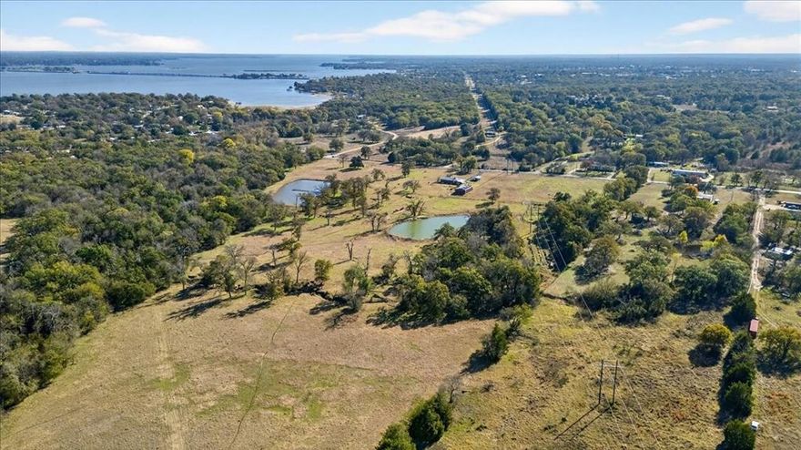 151+ Acres minutes from Cedar Creek Lake and only one hour from downtown Dallas!  Rare opportunity in a highly sought-after East Texas location. The land offers excellent flexibility and may be potentially subdivided, minimum 30.4 acres to be subdivided, making it well-suited for investors, multi-generational ownership, or phased development.  This property offers the perfect blend of accessibility, privacy, and long-term potential, making it ideal for subdevelopment, a private full-time residence, or weekend country getaways.  The surrounding area offers the best of lake-country living, with boating, fishing, golf courses, dining, wineries, and year-round recreation just minutes away, while still providing peaceful countryside views, open space, and lifestyle.  At the heart of the property sits a three bedroom, one bath farmhouse, with 1,320 square feet of living space.  Perfect as a primary residence, weekend retreat, rental, or guest home during future development.  Outdoor features include five scenic ponds, a seasonal creek, and cross-fencing that supports livestock, recreation, or agricultural use. A well-built metal shop adds value for equipment storage, hobbies, or working operations.  Whether your vision includes a serene homestead, a productive farm, a luxury country retreat, or a strategically located investment near one of Texas’s most desirable lakes, this exceptional property is ready to bring your plans to life.