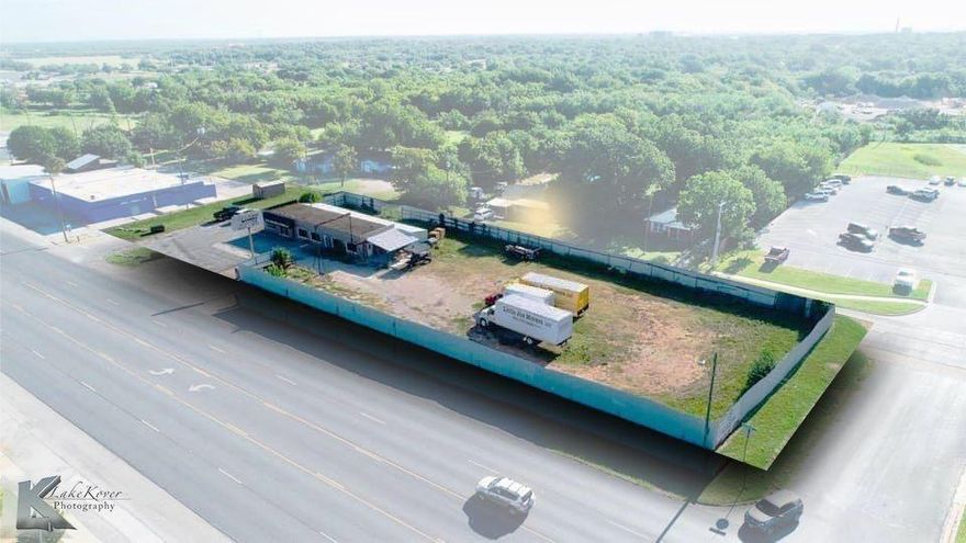 Great commercial property available for lease.  Discover the potential that this versatile property has to offer in a prime location.  The building features office space with plenty of climate controlled storage and warehouse storage.  The storage makes the ideal location for various operational needs with an added security system and convenience. The property is sitting on a large corner lot providing  ample parking.  The enclosed fenced area in the back is ideal for storing equipment, materials and vehicles.  Lots of room for your business to grow.
This will be a triple net lease.