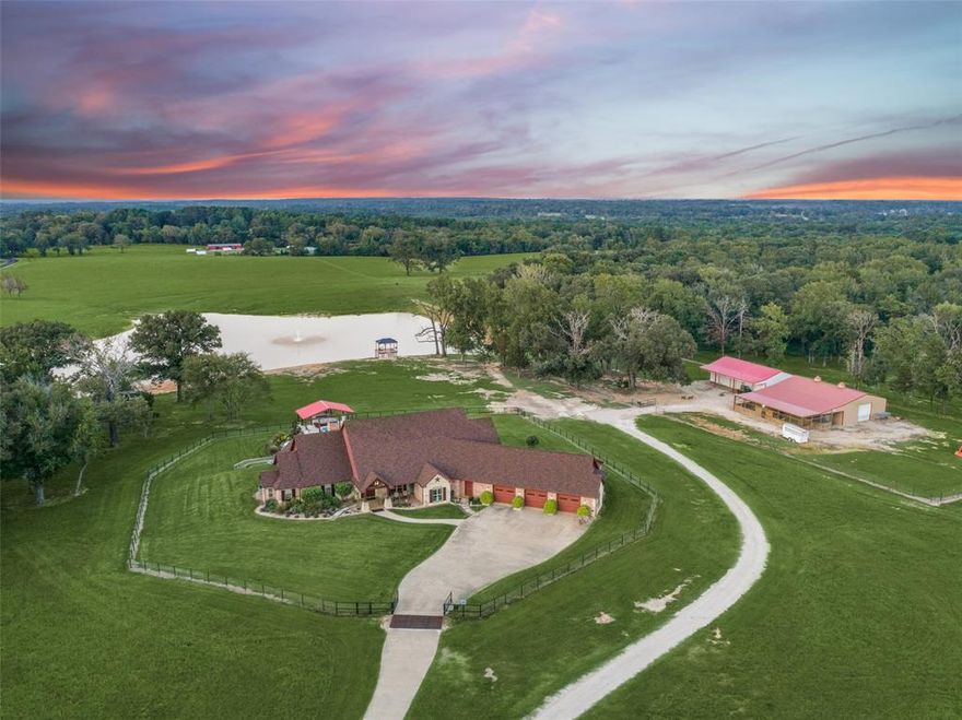 Discover this Unbelievable Property with 168 Acres of Pristine Pasture Land! Prime location right off HWY 757 and centrally located between Tyler and Longview with only a 1.5 hour drive to downtown Dallas. Meticulously maintained with 3 large rolling pastures with irrigation, tiered level pool oasis, 7 acre private pond and dock stocked by a 50 gal-per-min 5hp 450 ft well, 2 additional smaller ponds, working cattle pens and corral, and 2 barns with office spaces and workshops. Custom 3 bedroom home with quality craftsmanship and high attention to detail offering walls of windows with panoramic views of rolling pastures. Step outside to the lushly landscaped tiered backyard retreat with a resort pool and spa with waterfalls, pergola with outdoor living and enjoy the most beautiful Texas sunsets. Recent improvements include extensive land clearing, landscaping, new pergola and outdoor kitchen, and whole house Generac! Options for cattle grazing, hay sales, and other livestock, this working ranch offers comfort and success in the heart of East Texas with multiple business opportunities. Seller open to subdividing options! See attached list of full improvements and features!