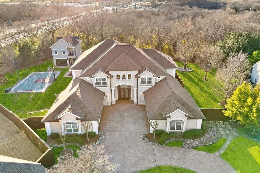 Stately mediterranean with guest house, 6 car garage & dreamy backyard on 0.74 acres! Plus a cul-de-sac lot in a gated neighborhood! Grand entry features double staircases, soaring ceilings & views through to formal living areas. Large kitchen boasts painted cabinets, granite, stainless appliances, incl an ice maker & a breakfast bar island. An adjacent, spacious breakfast nook is ideal, and both open to the family room featuring gorgeous arched windows & a cast stone fireplace. Private master bedroom features a tray ceiling, sitting area & luxurious bath with his&hers walk in closets. Convenient guest bedroom downstairs with en suite bath. Upstairs are three additional spacious bedrooms with en suite baths, plus a learning center, large game & media rooms! Dream backyard boasts a heated, saltwater diving pool (includes a retractable cover), sport court and remote screens for balconies & patio. Detached guest house with living room, bedroom, 2 full bath, kitchenette and loft w balcony!