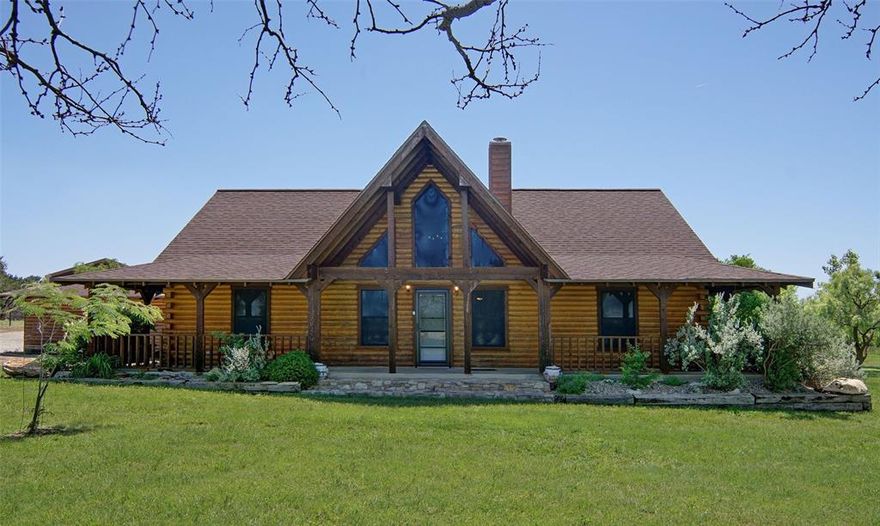 Get away from the hustle and bustle of city life at The Hills Above Possum Kingdom. This tranquil retreat is situated on a well manicured 4.9-acre property. The Charming log home offers three bedrooms, a bunkroom and two baths as well as a nice private and covered back patio for grilling, lounging or taking in the sounds of nature that surround you. You will delight in the outdoors where the sweat equity has already been invested, boasting a new 30 x 40 pull thru RV garage - shop or storage for all of your lake toys. For those with a passion for horses, a traditional three-head stall barn with a well-equipped tack room, and convenient storage. Newly built and painted pipe and non climb fence surrounds the rear portion of the property. The entire property, has seeded in fescue and coastal Bermuda. The property's crown jewel is a charming newly built+- .5 acre pond, perfect for relaxing by the water's edge or enjoying peaceful moments in nature. Don't miss this opportunity to own a piece of paradise in a tranquil country community just off the north end of Possum Kingdom Lake with ample space for privacy and outdoor activities. Amenities include gorgeous infinity edge pool, clubhouse with foosball, pool table, and well equipped gym. Ritchie Cabin located at the community boat ramp and courtesy dock i