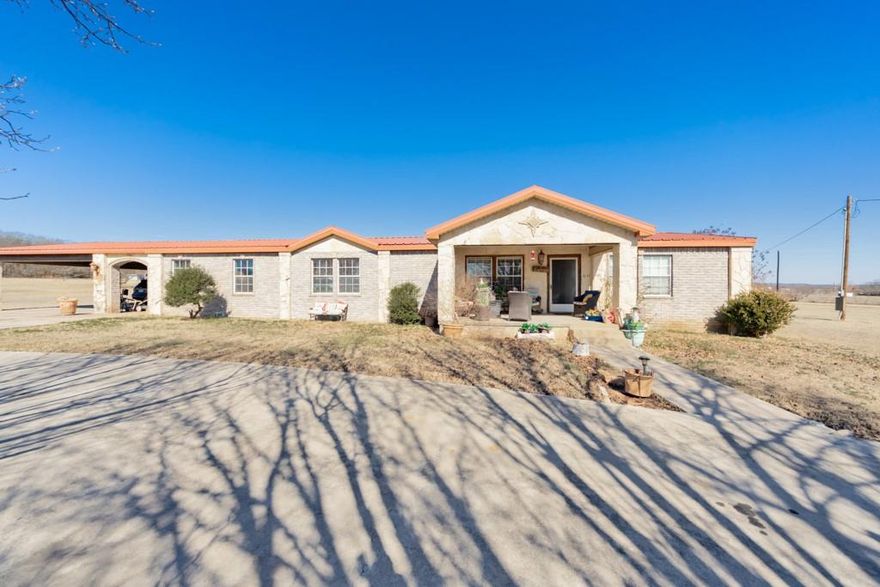 Country Dreaming- This 2.7+ acre home with western charm features a 3-2-2 home that has the perfect blend of comfort and Cowboy charm. From the time you step inside you are welcomed by a spacious foyer that flows into the open concept of dining, kitchen areas and two living areas. The master bath features a large claw footed tub and shower. The natural flow of the home allows the transition from living, dining, and kitchen areas into the bedroom areas. The kitchen is truly the heart of the home, featuring an oversized island that provides for the perfect setting for shared meals and memories. Step outside and take into the peaceful country setting. With 2+ acres there is room to roam, garden or simply enjoy the quiet. Equestrian enthusiasts will appreciate the 4 stall horse barn and tack room with additional feed-storage room. It's ready for your horses, livestock or hobbies. All this just a mile or so from Selma Park on Lake Amon G Carter.