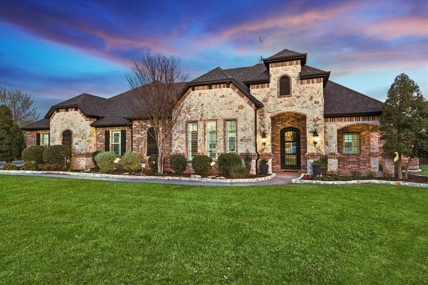 Nestled in a quiet cup-de-sac, this exquisite four-bedroom, 3.5 bath home boasts an array of luxurious features that promise comfortable living. The brick and stone exterior exudes timeless elegance. This house showcases two living areas and a spacious eat-in kitchen, complete with double ovens, a gas range, and dry bar with two wine refrigerators. The large master suite is a private haven, featuring direct access to the patio, an ideal spot to enjoy a morning coffee. The second floor has a large game room, perfect for entertaining. The expansive interior includes updated flooring, plantation shutters, extensive trim, and a striking iron door. Sitting on over half an acre with a pool, outdoor kitchen and large, fenced back yard, there is plenty of room to roam and play. This property is a perfect blend of elegant design, comfort and functionality.

Offering $10,000 towards closing costs or rate buy-down.