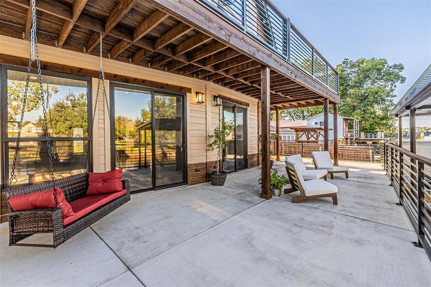 DONT DISMAY OVER THE 3 STORIES! THIS ONE IS EQUIPTED WITH AN AMAZING ELEVATOR FOR LUXURY CONVENIENCE....VRBO'S ALLOWED IN THIS AMAZING NEIGHBORHOOD! UNMATCHED QUALITY IN THIS VERY COOL HOUSE. HGTV STYLE UPGRADES AND AS ORIGINAL AS IT GETS!! 2.5 Stories of beauty, Great room-garage, 3 custom bathrooms, 27 windows, 5 sliding glass doors, AND AN ELEVATOR!!! Custom all ALL THE way, fully foamed, custom cabinets, three quarter wrap around balcony where you can see water from pretty much every point of this home. High end EVERYTHING! Tons of custom stain grade touches, doors, window seals, cable railing and stain grade railing to the primary bedroom and thruout home, custom shower system in primary bath, custom bathrooms with frameless barndoor shower doors, Leather granite (very high end) on kitchen Island and coffee bar, Custom doors made by a famous craftsman out of Houston at lower level entry and front door on second level, Custom insulated Cedar garage door, tons of Stain grade doors, baseboards, window seals, and cabinets...high end quartz mixed with style and elegance in kitchen and bathrooms where no expense was spared to make this your dream home. DO NOT MISS OUT ON THIS ORIGINAL, TOP OF THE LINE HOME WITH ALL THE BELLS AND WHISTLES. NEW BOAT DOCK!! With all the touches you need to make this home your HOME. AS my mother in law says ****you really outdid ourselves this time****AWESOME NEIGHBORHOOD, AMAZING NEIGHBORS, where EVERYONE ALL 6 streets are on the water!! Ports O Call is the only neighborhood where ALL home are waterfront, neighbors are close, ride around on golf carts or side by sides, people get together, talk to each other, walk, walk our dogs, and have a community unmatched to any other neighborhood in this wonderful town!