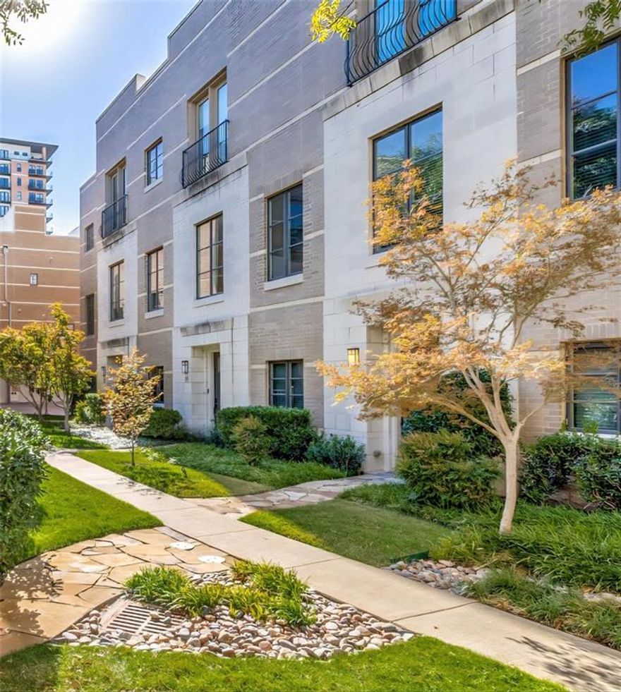 Exceptional 3-story home in the heart of Uptown only 1 block from the Katy Trail delivers the perfect mix of style, space and outdoor living. Two brand-new Carrier HVAC systems installed May 15, 2026. New tankless water heater installed for efficiency and long-term savings, plus complete replacement of Juliet balcony doors & windows. Fully updated garage system too. Home warranty included. Built in 2006, the 2 bedroom 3 bath home includes a bonus room, ideal for home office. This home gives you true breathing room with over 2300 sqft paired with soaring 11-foot-high ceilings. Rich chocolate cabinetry & quartz—granite countertops throughout set the tone for elevated living. The open-concept with hardwood floors creates a seamless flow between the kitchen, dining and living area, perfect for entertaining. Kitchen is a showstopper with oversized cabinets, large island, stainless steel appliances & walk-in pantry. Living area includes built-in entertainment nook, wine bar & wine fridge, adding a touch of luxury to your everyday. Spacious primary suite has Juliet balcony, sitting area, large spa-inspired bathroom with dual undermount sinks, oversized mirror, jacuzzi tub, separate glass shower, water closet and walk-in closet. Full-sized washer & dryer area located on same floor. Second bedroom has full bath—ideal for guests. Private 4th floor rooftop deck invites you to enjoy sunsets, starlit evenings and unforgettable gatherings with room to mount a flat-screen TV, hang string lights—it’s your personal open-air lounge. Additional highlights; attached 2-car garage, access to resort-style pool with waterfall—all tucked into a quiet residential enclave yet surrounded by the energy, elegance and connection that only Uptown can offer. Prime location with trolley 1 block away providing car-free access to everything the area offers. West Village, Whole Foods, Trader Joe's, tennis & pickle ball courts close by. You’re not just purchasing a property, you’re claiming a lifestyle.