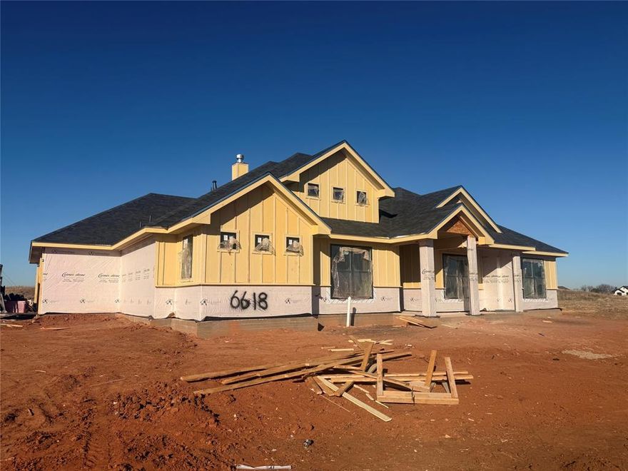 Stunning New Construction in Elm Creek at Wylie – 4 Bed, 3 Bath, Corner Lot, 3-Car Garage 
Experience exceptional design and comfort in this brand-new, 2026-built custom home located in the highly sought-after Elm Creek at Wylie subdivision. Situated on a beautifully landscaped 0.30-acre corner lot, this single-story residence offers 2,550 sq ft of thoughtfully planned living space and premium finishes throughout. Including a European bath & shower in primary bath.    
Step inside to an open floor plan featuring luxury vinyl plank flooring, decorative lighting, and a spacious 19×21 living room centered around a warm wood-burning fireplace. The gourmet kitchen is built for both style and function with a large island, pantry, eat-in area, and premium appliances including an electric range, microwave, dishwasher, disposal, and electric water heater.
This home offers two primary-style suites, perfect for multi-generational living. The main primary bedroom (14×16) features a custom closet system, dual sinks, Hollywood bath, walk-in closet, and built-ins. The second primary (12×14) also includes a custom closet, built-ins, and a beautifully appointed ensuite bath with a separate shower.
An additional dedicated office space provides the perfect setup for remote work or study.
Enjoy year-round outdoor activities on your  covered back patio that offers the ideal outdoor space for relaxing or entertaining.
Parking and storage are a breeze with the oversized 3-car attached garage (23×30×9) with side-facing garage doors and opener. The property also features a full sprinkler system, fenced backyard, and professional landscaping.