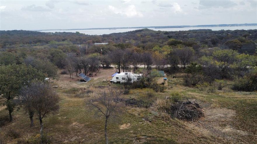 Escape the hustle and bustle of the city. This beautiful wooded .218 acre lot is just waiting for you to show up with your own builder and house plans or install a MF home on it. No HOA here, just kick back and relax in the peaceful surroundings of Runaway Bay. Plan to visit soon!