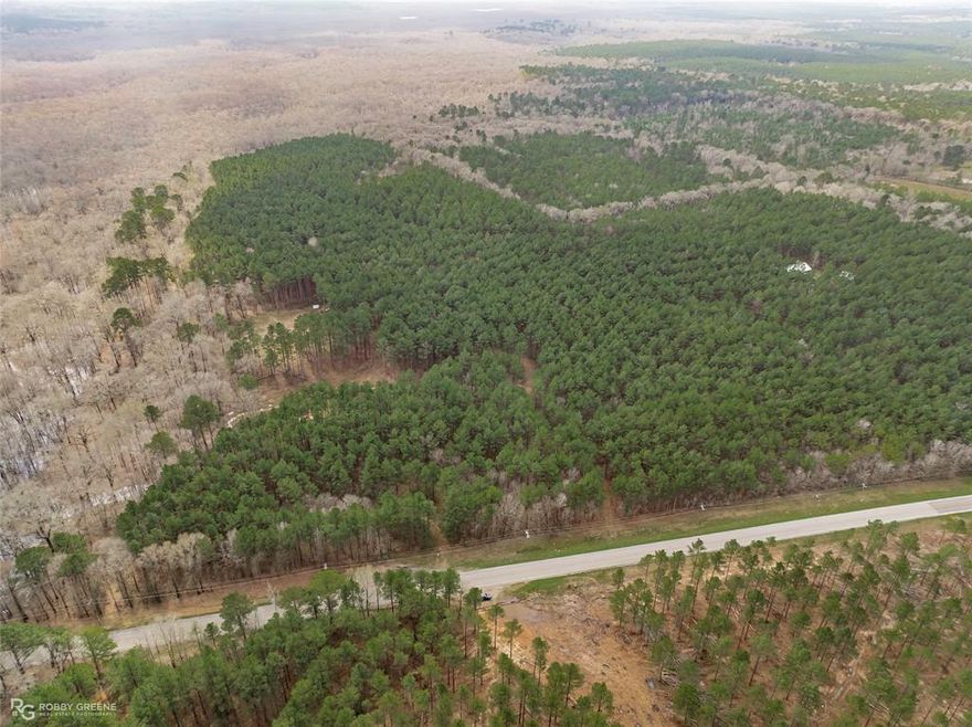 Discover this stunning wooded tract of land, offering the perfect blend of natural beauty and privacy. This super nice piece of property features a mix of pine and hardwood trees, making it an ideal spot for outdoor enthusiasts or those looking to build their dream home. Enjoy direct access to Bodcau Creek and neighboring Federal Land, providing ample opportunities for recreation and exploration. Located within the highly regarded Benton School District, this property is perfect for families seeking a serene yet convenient lifestyle.