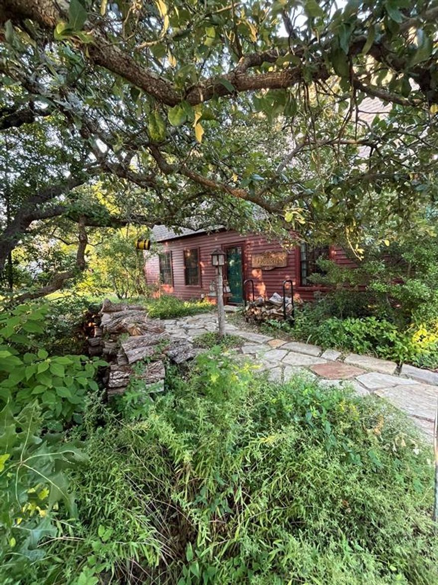 Welcome to this charming cottage-like retreat, offering the perfect blend of comfort, character, and outdoor luxury. This inviting home features a brand-new roof and timeless cottage touches throughout, creating a warm and airy atmosphere from the moment you step inside.  Out back, you’ll find a true private oasis: a sparkling pool, relaxing hot tub, and a stylish cabana designed for effortless entertainment and peaceful lounging. The yard is thoughtfully landscaped with native plants, adding natural beauty, low-maintenance appeal, and year-round color. Although this home has been seated on the market longer than expected, it’s a hidden gem with incredible value—ready for the right buyer to appreciate its charm, upgrades, and resort-style outdoor living. Come see why this cottage-inspired haven stands out from the rest. It’s truly a place to slow down, unwind, and feel at home. This custom-built home has reclaimed wood floors throughout, double hung Pella insulated windows and double sided-fireplace. Kitchen boasts custom apothecary cabinets, granite counters, 6-burner gourmet stove. Exquisite shiplap ceilings in living room and kitchen. Two bedrooms upstairs with flex area for an office, library, or sitting area, bring your imagination. Primary Bedroom downstairs, both bathrooms have double vanities.