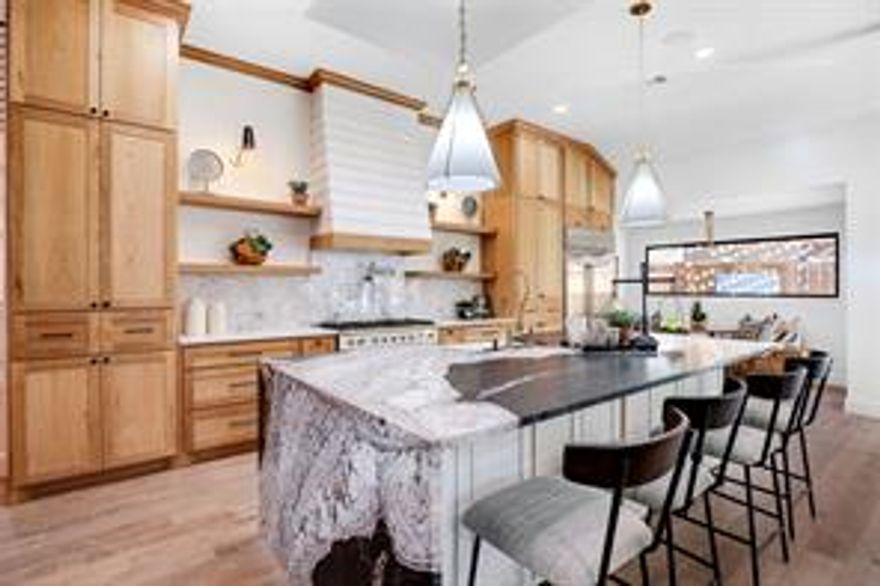 Ultra-Luxury total renovated expanded European Farmhouse-style gem wrapped in hand-cut
stone with a circular drive, maintenance-free landscaping with irrigation and synthetic
grass. Stackback doors open to your luxury outdoor oasis with a sparkling resurfaced
pool with new equipment, amazing yard for entertaining with a TV-sitting area, outdoor fire
pit and kitchen with bar, plus a self-ventilated cigar room and wine room! Every detail is
luxurious from the foundation up with steel beams, new windows, doors, roof, wiring,
plumbing, HVAC, water heaters and 2 added 2nd stories, one on each side of the house.
Sun-filled interiors wow with an open flow and top finishes at every turn, including a dog
shower.