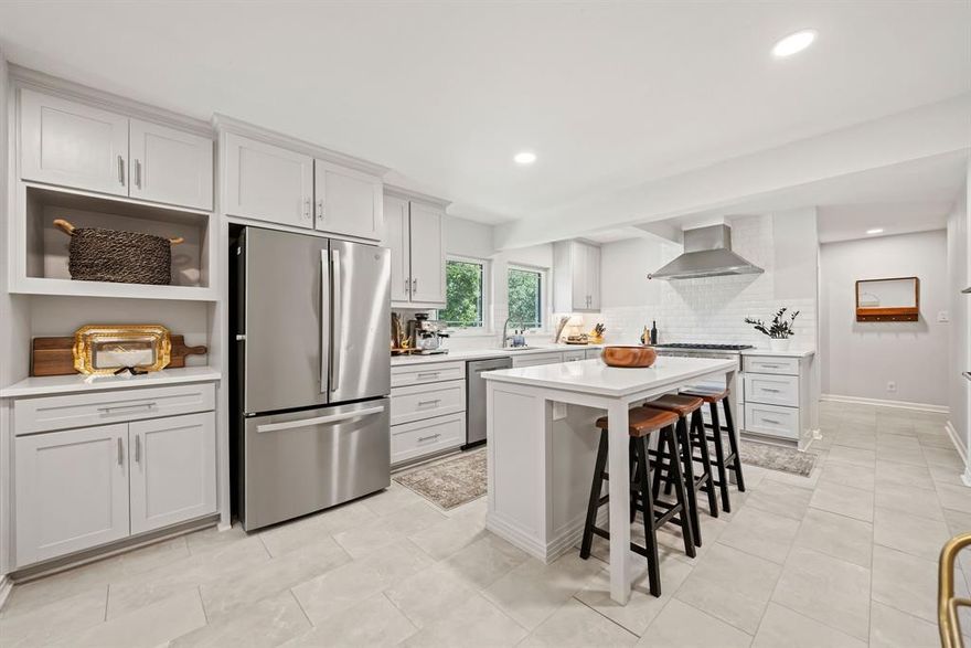 **$5,000 SELLER CONCESSION offered for Rate Buydown or Closing Costs** Located in the heart of Ryan Place, Fort Worth’s only residential neighborhood listed on the National Register of Historic Places, this charming 4-bedroom, 3-bath home offers a rare combination of historic character, modern convenience, and an unbeatable sense of community. Built circa 1950 on a premium corner lot, the home features original hardwood floors, a vintage tile bathroom, and thoughtfully preserved period details. Natural light pours in through new large picture windows that honor the home’s classic style while improving energy efficiency. The chef-grade kitchen is a true standout, showcasing professional-grade appliances including a Monogram 6-burner gas range and Zephyr vent hood—an exceptional feature in this historic district. With abundant cabinetry, open shelving, quartz countertops, and a large island with seating, the kitchen is both beautiful and functional. Two bedrooms feature ensuite baths, and the layout includes a cozy breakfast nook and a formal dining room. Major infrastructure updates—energy-efficient windows, upgraded copper plumbing and gas lines, a new electrical panel, completed foundation repairs, and a commercial-grade exterior AC unit installed in 2024—offer modern reliability while maintaining the home’s timeless appeal. A rare attached, side-entry 2-car garage with storage adds tremendous value, as most Ryan Place homes lack attached garages altogether. Originally established in 1911 and once home to Fort Worth’s elite, Ryan Place remains one of the city’s most beloved neighborhoods, known for its strong community and annual events like the Christmas Home Tour, Fourth of July Parade, and Halloween celebrations. This is a rare opportunity to own a beautifully updated historic home in one of Fort Worth’s most iconic and welcoming communities.