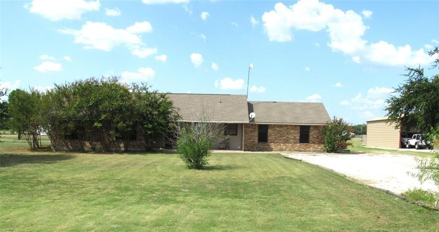 1.955 ACS. AT 4688 CR 2604. WELCOME TO THIS COUNTRY HOME WAITING FOR A FAMILY! 3 BEDROOM, 2 BATH, 2 CAR GARAGE WITH STORAGE BLDG. OPEN FLOOR PLAN. UNIQUE VAULTED CEILING IN THE LIVING ROOM, STAIN GLASS OVER DOORWAY ENTRANCE TO THE DINING ROOM. UPDATED FIXTURES, WATER  HEATER, PEDESTAL SINKS, AND 4 TON HVAC WITH HEAT PUMP. THERE IS ROOM FOR A FREEZER IN THE UTILITY ROOM. SIT OUT ON THE COVERED FRONT PORCH. A FEW TREES, AND LARGE BACK YARD FOR CHILDREN TO PLAY GAMES OR RIDE 4 WHEELER. THE WASHER,DRYER, REFRIGERATOR AND HUSTLER LAWN MOWER ARE TO CONVEY WITH THE PROPERTY. LOCATED IN THE EXEMPLARY CADDO MILLS ISD. DON'T WAIT COME AND TAKE A LOOK!!