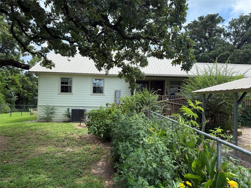 Country charm abounds here on this 1.6 acre parcel full of hardwood trees and native plants. Windows throughout this clean and modern 3 bedroom , 2 bath custom home that also features several enclosed porches to enjoy tons of bird watching and garden views. The home has an open floor plan which features a spacious kitchen, dining and living area. Oversized bedrooms and bathrooms, private sitting room, and a craft room with laundry facilities adds functionality.
