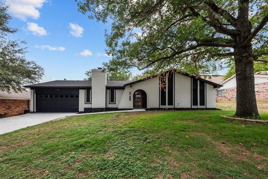 Beautifully renovated home, just 20 min from downtown Fort Worth. Modern off-white and black bold lines on exterior with a 4 Lite Mahogany door, that give this home major curb appeal. New concrete driveway and sidewalk. Living area is enormous with a very nice fireplace. Open Concept kitchen with a massive bar island that fits up to 6 people, including granite countertops, subway backsplash, and a huge rectangular sink. New refrigerator included with home. All new 12MM waterproof laminate flooring throughout home that is pet friendly and NO CARPET. Restrooms have updated Tile flooring, new cabinets and quartz countertops, with the master bath having a walk in shower. Laundry Room has big new sink and pattern tile that looks amazing. Back yard is spacey, contains a wide covered patio and has been re-graded. Roof is brand new as well as insulation in attic. New solar screens added to windows. Home has so many more upgrades to mention. Oh and NO HOA. Book showing now before it's too late.