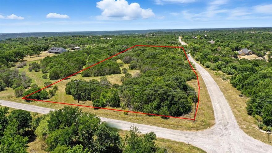 Looking for a highly buildable lot? This one is a must see with lots of level ground, oaks, soft woods and native grasses, meadow areas and several choices for home sites as this is a corner lot. This property is ready for your forever home or enjoy the wonderful amenities until you are ready to build.  You may also bring up to 5 of your large animals.  Mountain Lakes Ranch offers an approximate 100 acre recreational lake and an approximate 45 acre world class fishing lake designed by angler Jimmy Houston. Enjoy the Community pool, Clubhouse, Exercise park along with a Play park, RV parking, Storage and Community garden. Come and enjoy the beautiful hill country that Bluff Dale, Texas offers.