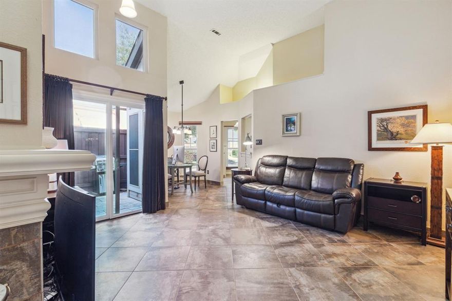 A COMFORTABLE BLEND OF URBAN AND SUBURBAN LIVING. A warm and welcome ambiance greets you as you enter this remodeled townhome with twin primary suites. Pronounced high vaulted ceilings, windows galore, and beautiful tile throughout creates an airy and spacious atmosphere and living space. Two ample sized bedrooms with full bathrooms. Located in a peaceful desirable neighborhood off busy streets. The Gables at Royal Lane. The bustling Metroplex is a short commute in all directions. Come home to an enhanced landscaped surrounding that gives you the touch of being much closer to nature. The home is designed and upgraded with multiple amenities including infrared pollen reduction in the duct work and a custom surge protector on the electrical system. Additionally, a one car enclosed attached garage and two patios for relaxing.