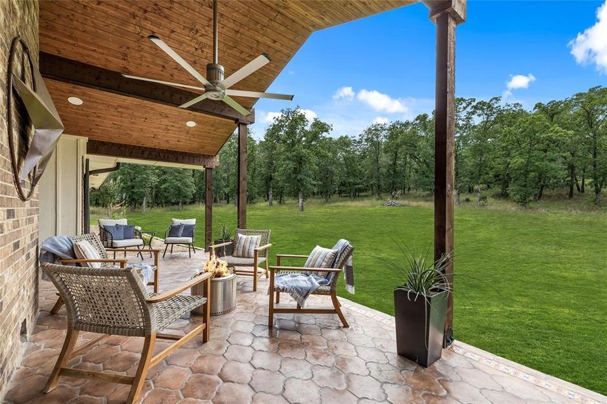 Welcome to your dream ranch home in the heart of the coveted Bartonville, Texas. This stunning custom-built home boasts 5 spacious bedrooms, 3 and a half baths, and has been thoughtfully and tastefully updated. Nestled amongst majestic mature oak trees, this property offers a serene and private oasis. The small horse barn and professional riding arena are perfect for the equestrian enthusiast. Expansive kitchen with quartz counters and stainless appliances.  Ample space for entertaining, the kitchen seamlessly flows into the inviting family room, creating a great informal space to create memories. Cozy up in front of the gorgeous stone fireplace. New sliders lead to the covered back porch complete with a Big Ass fan, is the perfect spot to relax and take in the peaceful surroundings. As you make your way to the custom stone front porch and large stone terrace, you'll be greeted by sweeping pastoral views. It's the perfect space to unwind after a long day or entertain guests in style.