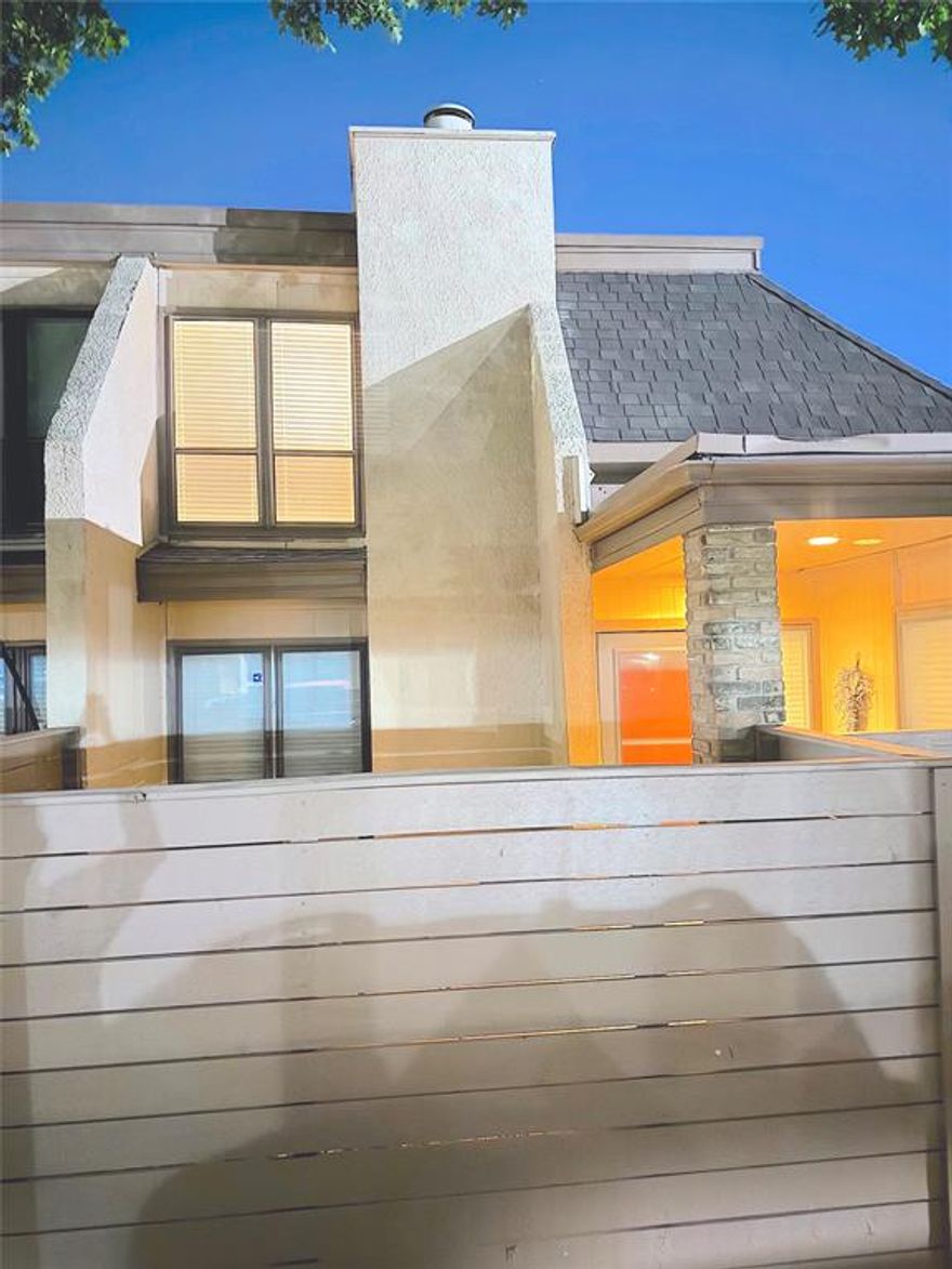 Charming 2-bedroom, 2-bath condo featuring two levels of comfortable living.  The main floor offers a spacious living area with a cozy fireplace, a small dining space and an eat-in bar perfect for casual meals. Rigid-core vinyl plank flooring throughout the first floor. Upstairs both the bedroom and full bath offers privacy and flexibility-perfect for a guest suite or home office setup. Enjoy outdoor relaxation on the private patio with room for rose bushes or a small garden, shaded by a beautiful tree.  Community amenities include a pool, laundry-mail room, and covered carport parking. Conveniently located near Love Field Airport, DFW Airport, and just minutes from Downtown Dallas.