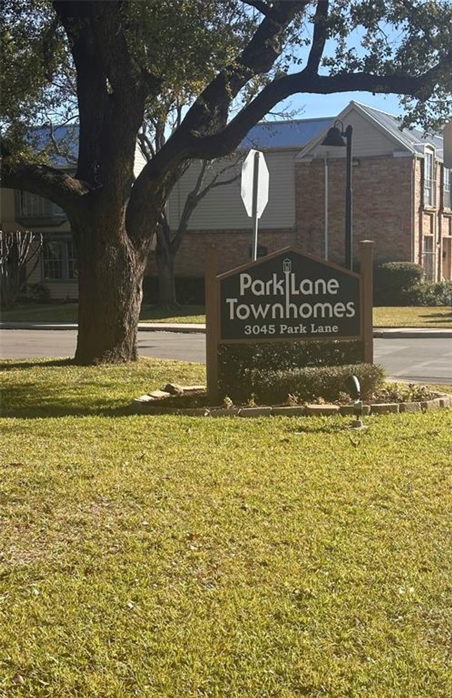 Charming 2-bedroom, 2-bath condo featuring two levels of comfortable living.  The main floor offers a spacious living area with a cozy fireplace, a small dining space and an eat-in bar perfect for casual meals. Enjoy outdoor relaxation on the private patio shaded by trees.  Community amenities include a pool, laundry-mail room, and covered carport parking. Conveniently located near Love Field Airport, DFW Airport, and just minutes from Downtown Dallas.