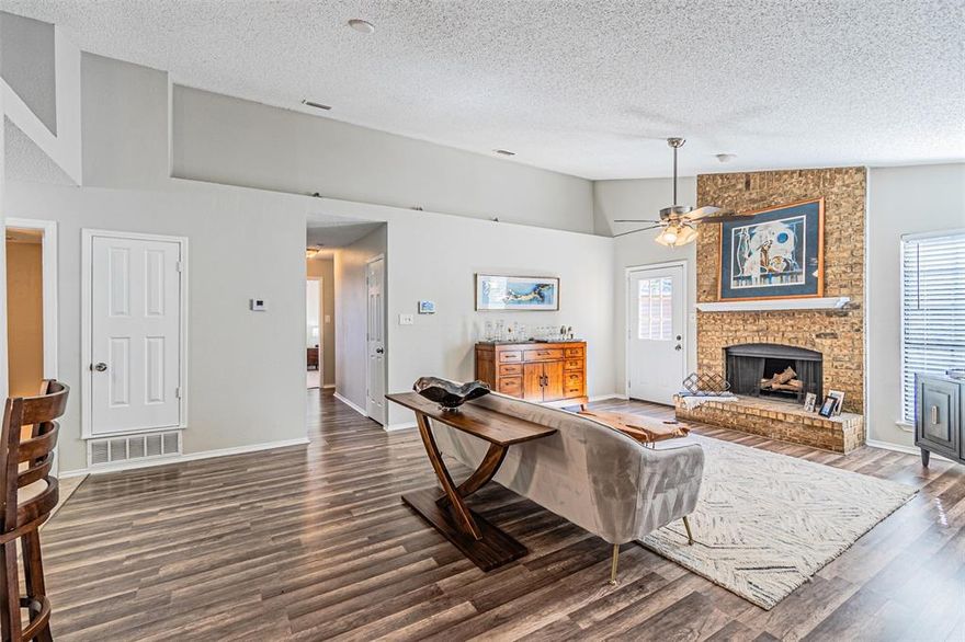 Move-in ready corner-lot home with major updates—including a 2023 roof and refreshed interior. An inviting one-story perfectly positioned on a corner lot in Fort Worth, offering both privacy and standout curb appeal from the moment you arrive.
Built in 1987 and thoughtfully updated, this 4-bedroom, 2-bath home with a 2-car garage spans approximately 1,760 square feet and delivers an ideal blend of comfort, functionality, and versatility—perfect for first-time buyers, growing families, or those looking to downsize without sacrificing space.
Step inside to a bright, open layout filled with natural light. The main living area features beautiful plank wood flooring and a classic brick, wood-burning fireplace—creating a warm and welcoming focal point for everyday living or entertaining. A second living space offers even more flexibility, highlighted by a striking brick accent wall, with a beautiful built-in bookcase and sliding door access, and an abundance of natural light—ideal for hosting gatherings or creating a relaxed retreat.
The kitchen is designed for both convenience and connection, featuring a cozy breakfast nook and breakfast bar—perfect for casual meals, morning coffee, or conversation while cooking.
The flexible fourth bedroom can easily serve as a home office, playroom, or guest space to fit your buyers’ needs. The thoughtfully designed floor plan provides privacy, with the primary suite tucked away at the end of the hallway, while two additional bedrooms and a full bath are positioned nearby for family or guests.
Recent updates add to the home’s appeal, including fresh interior paint, nice carpeting in all bedrooms, and a refreshed primary bathroom with updated countertops and fixtures—giving the home a clean, modern, move-in ready feel.
Outside, the spacious backyard features a patio area with a small shed with electric hookups and newly installed fencing—perfect for entertaining, grilling, or simply unwinding in a private outdoor setting.